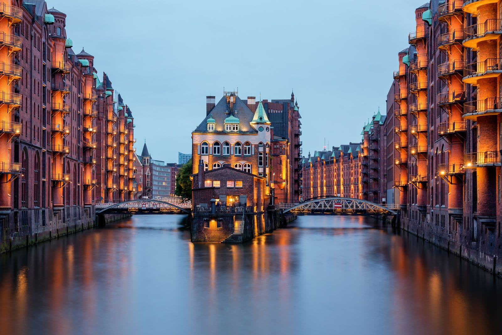 Hamburg's Speicherstadt at dusk, reflected in the canal